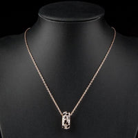 Side angle view of KHAISTA jaguar design link chain crystal necklace