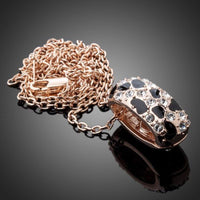 Close up detail of KHAISTA jaguar design link chain crystal necklace