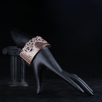 Side angle view of KHAISTA jaguar print crown bangle