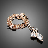 Close up detail of KHAISTA leaf shaped crystal pendant necklace
