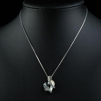 Close up detail of KHAISTA light blue crystal heart pendant necklace