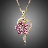 KHAISTA light gold pink crystal flower necklace on white background