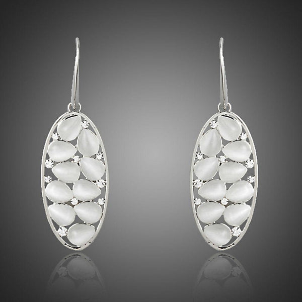 KHAISTA light grey crystal oval drop earrings on white background