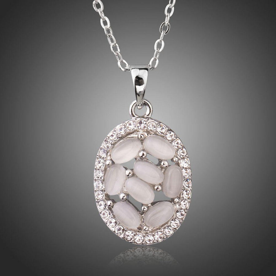 KHAISTA light grey oval crystal necklace on white background