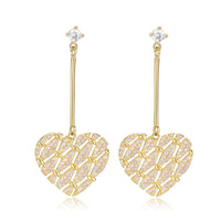Close up of KHAISTA light pink zirconia heart drop earrings