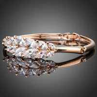 Close up detail of KHAISTA lightweight crystal feather bangle