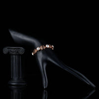 Side angle view of KHAISTA lightweight crystal flower bracelet
