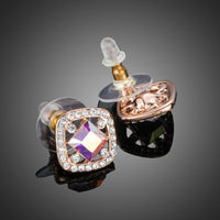 Close up of KHAISTA lightweight crystal square stud earrings