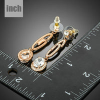 lightweight dangling G-shape drop earrings detail view by KHAISTA