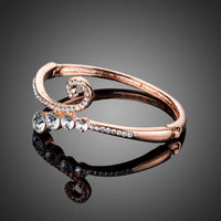 Close up detail of KHAISTA lightweight rose gold plated bangle