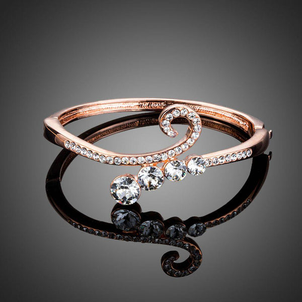 KHAISTA lightweight rose gold plated bangle on white background