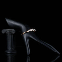 Side angle view of KHAISTA lightweight round crystal bangle