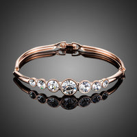 KHAISTA lightweight round crystal bangle on white background