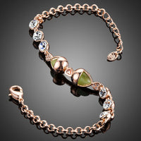Close up detail of KHAISTA lime crystal fish charm bracelet