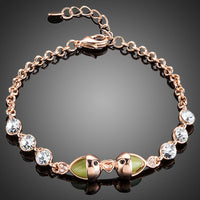 KHAISTA lime crystal fish charm bracelet on white background