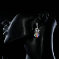 Side angle view of KHAISTA large crystal drop earrings