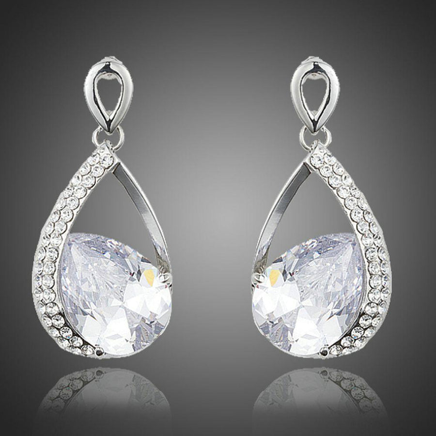 KHAISTA CZ drop earrings on white background