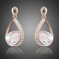 KHAISTA gold plated CZ drop earrings on white background