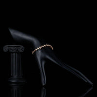 Side angle view of KHAISTA CZ leaf lobster clasp bracelet