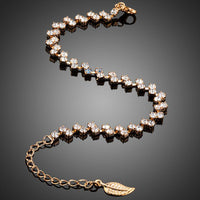 Close up detail of KHAISTA CZ leaf lobster clasp bracelet