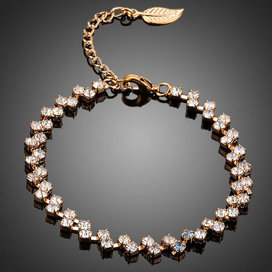 KHAISTA CZ leaf lobster clasp bracelet on white background