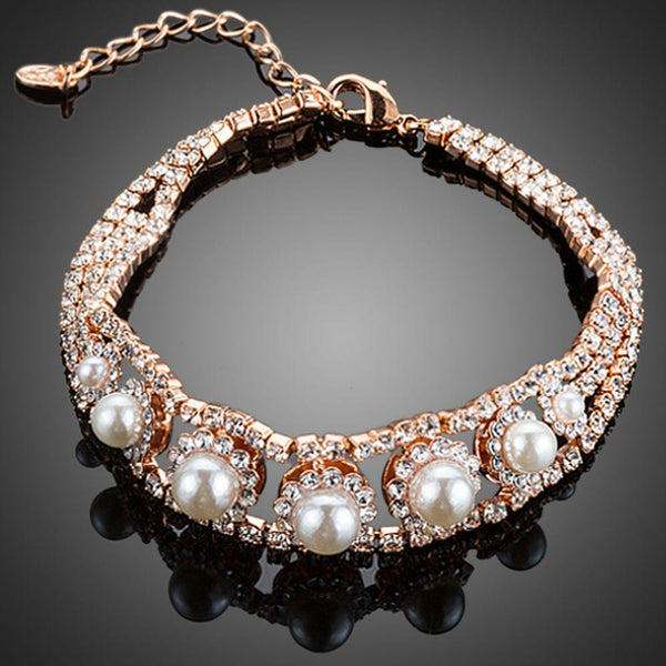 KHAISTA CZ pearl lobster clasp bracelet on white background