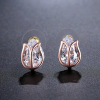 Side angle view of KHAISTA lotus crystal stud earrings