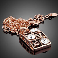 Side angle view of KHAISTA love design Stellux Austrian crystal necklace