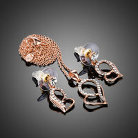 Side angle view of KHAISTA rose gold heart set