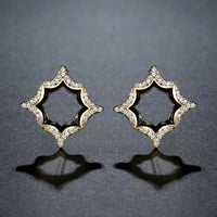 Close up of KHAISTA luxury geometric crystal stud earrings