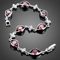 Close up detail of KHAISTA maroon CZ eye shape bracelet