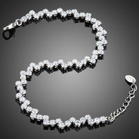 Close up detail of KHAISTA marquise cut CZ tennis bracelet