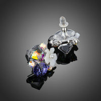 Close up of KHAISTA multicolour flower crystal stud earrings