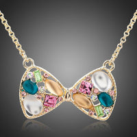 KHAISTA multicolour crystal bow knot necklace on white background