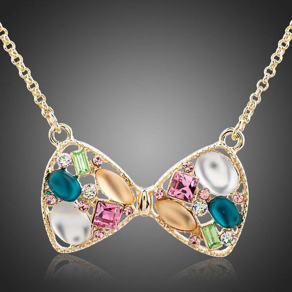 KHAISTA multicolour crystal bow knot necklace on white background