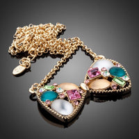 Side angle view of KHAISTA multicolour crystal bow knot necklace
