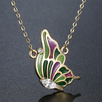 Close up detail of KHAISTA multicolour crystal butterfly necklace