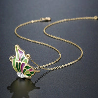 Side angle view of KHAISTA multicolour crystal butterfly necklace