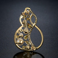 Side angle view of Khaista gourd pearl brooch