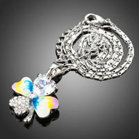 Close up detail of KHAISTA multicolour flower heart pendant necklace
