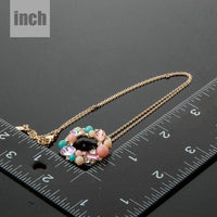 Pendant detail on KHAISTA multicolour round crystal pendant necklace