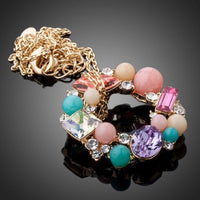 Close up detail of KHAISTA multicolour round crystal pendant necklace