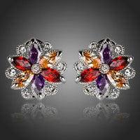 KHAISTA multicoloured flower stud earrings on white background
