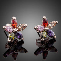 Side angle view of KHAISTA multicolour Stellux Austrian stud earrings