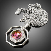 Side angle view of KHAISTA octagon crystal pendant necklace