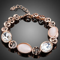 KHAISTA opal crystal lobster bracelet on white background
