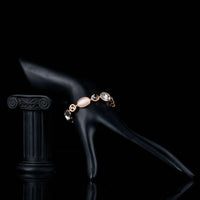 Side angle view of KHAISTA opal crystal lobster bracelet
