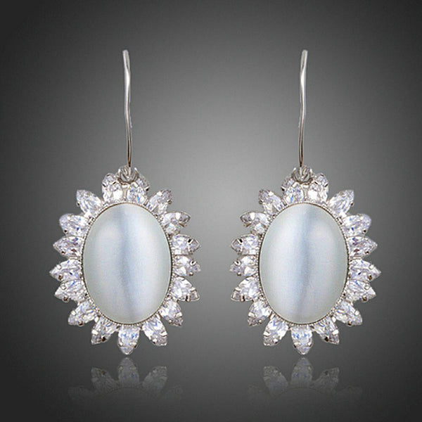 KHAISTA opal CZ drop earrings on white background