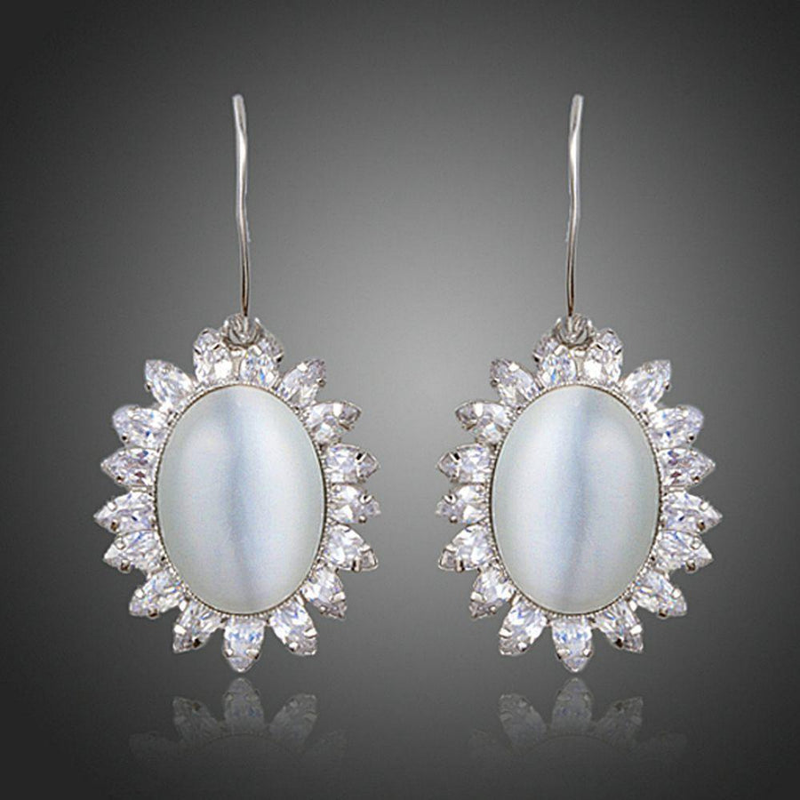 KHAISTA opal CZ drop earrings on white background