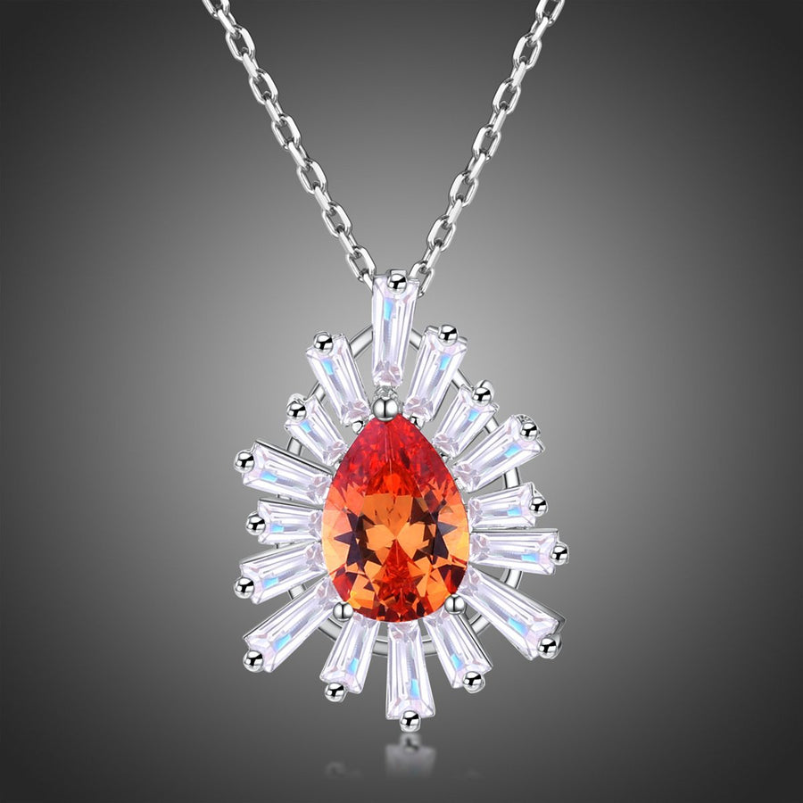 KHAISTA orange CZ chain pendant necklace on white background